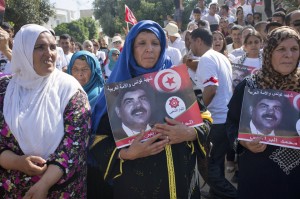 Mourners with portrait of Tunisian oppostion politician, Mohammed Brahimi