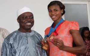 Governor Emmanuel Uduaghan of Delta State (left) congratulating Blessing Okagbare (right) during a State reception in her honor her following her brilliant performance at the 2013 World Athletics Championship in Moscow, in Government House, Asaba, Friday. 