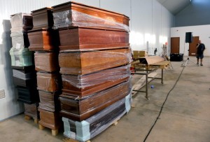 Coffins for drowned African migrants at the hangar of the Lampedusa airport following the shipwreck