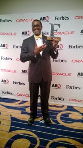 Adesina with the Forbes award plaque