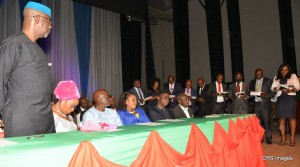 PIC CAPTION Cross River State Governor, Senator Liyel Imoke(left standing,) the wife Obioma, Speaker State House of Assembly, Hon. Larry Odey and wife, Eneyi Odey, state chairman of PDP, Ntufam John Okon and a rep of the state's chief judge watching the newly sworn-in local government chairmen taking oath of office in Calabar, Monday.