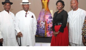 From L – R: Executive Secretary/CEO, National Institute for Cultural Orientation (NICO), Abuja, Dr. Barclays Ayakoroma, Bayelsa State Deputy Governor, Rear Admiral John Jonah (Rtd), an International Exhibitor, Patience Torlowei of Bayelsa State, and the Bayelsa State Commissioner for Culture & Ijaw National Affairs, Dr. Felix Tuodolor, during the send-forth ceremony of the award winning dress ‘Esther’ ( at the background) designed by Patience Torlowei, to the Smithsonian National Museum of African Art, Washington DC, at the Banquet hall, Government House, Yenagoa.