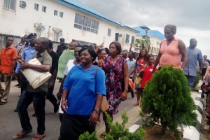 striking health workers of federal medical centre yenagoa in a street procession to protest non payment of outstanding allowance