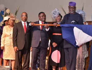 Outgone Governor of Cross River, Sen. Liyel Imoke performing the symbolic presentation of the State's flag to the new Governor, Prof. Benedict Ayade, shortly after the latter took the oath of office in Calabar.