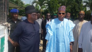 Governor of Ebonyi State, Eng David Umahi(left) and his Borno State counterpart, Alhaji Kasheem Shettima during the presentation of bags of Ebonyi rice and wrappers by Ebonyi State Government for Borno's Internally Displaced Persons in Abuja on Wednesday. 