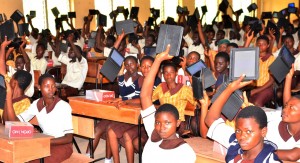 Permanent Secretary, Ministry of Education, Mr. Lawrence Oyeniran, presenting Tablet of Knowledge (Opon Imo) to an SSS 3 Student of the Adventist High School, Ede, Ogundiya Musefiu; Principal of the school, Mr. Anthony Ojo (4th right), and a teacher, Mrs. Ogungbaroye Janet, during the second phase flag-off and distribution of Tablets of Knowledge to Senior Secondary School Students across the Public High Schools in the State, at the Adventist High School's Premises, on Friday 13-11-2015.