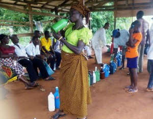 A POTENTIAL CUSTOMER SAMPLES THE TASTE AT A PALMWINE MARKET, NEW AFOR UMABOR MARKET, EHA ALUMONA COMMUNITY, ENUGU STATE.28/10/2015