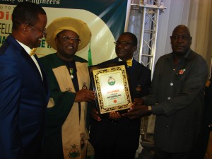 L-r: Maj.Gen. Obi Umahi(retd.) Ebonyi State Governor David Umahi; President of the Nigerian Society of Engineers, Engr. Ademola Olorunfemi and the Secretary to the Government of the Federation, Babachir Lawal, at at the conferment of a Fellowship of the Nigerian Society of Engineers on Gov. Umahi by the NSE in Abuja on Wednesday. Photo;EBSG