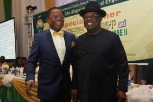 Governor David Umahi of Ebonyi State (right)  and Maj. Gen. Obi Umahi during the conferment of NSE fellowship on Umahi  in Abuja on Wednesday.