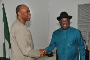 R-L: Governor David Umahi being congratulated on his electoral victory at the Supreme Court by his Ondo State counterpart and Chairman of the Peoples Democratic Party Governors Forum, Dr. Olusegun Mimiko, shortly before the PDP Govs Forum meeting in Abuja ...on Wednesday night. Photo: EBSG