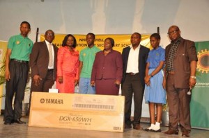 Winners of the 14th edition of the NNPC/SNEPCo music competition; L-R: Music Co-ordinator,  Murtala Mohammed Airport Secondary School, Mr. Okedeji James; Head, Business Relations, Shell Nigeria Exploration & Production Company Limited (SNEPCo), Mr. Alan Udi; Supervisor, Community Development, National Petroleum Investment Management Services (NAPIMS), Mrs Bunmi Lawson; a student of Murtala Mohammed Airport Secondary School , Leonard Idowu-Dawodu; representative of the wife of the Governor of Lagos State, Mrs Jumoke Adeyemi; Pianist, Olufemi Adebayo; another student of Murtala Mohammed Airport Emmanuella Kyllians and the Co-ordinator, Musical Society of Nigeria (MUSON), Sir Emeka Nwokedi.