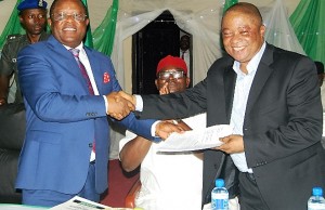 Governor David Umahi of Ebonyi State (left); and Chairman, Ibeto Group, Chief Cletus Ibeto at the signing of an agreement for the revitalization of NIGERCEM, Nkalagu in Abakaliki, Ebonyi State on Friday. with them is Senator Obinna Ogba (middle). Photo: EBSG