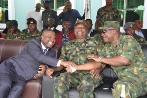 NDDC Managing Director, Mr. Nsima Ekere, (left), exchanging pleasantries with Air Vice Marshall, Stephen Onuh (right) and Rear Admiral Victor Adedipe (middle) of the Nigerian Navy during the Operationalization ceremony of the 6 Division of the Nigerian Army in Port Harcourt.