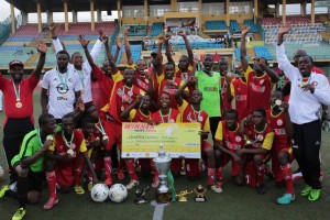 L-R: General Manager, Shell Nigeria, Igo Weli; Chairman, Lagos State Sports Commission, Deji Tinubu; Captain, Hensen Demonstration School Team, Osunde Nosakhare; and Public Affairs Supervisor, National Petroleum Investment Management Services, Bunmi Lawson, after presenting the NNPC/Shell Cup trophy to the winning team... on Tuesday.