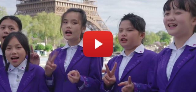 Children from Wuzhishan, Hainan Sings on the Seine in Paris during the opening performance of the Sino-French Gourmet Carnival